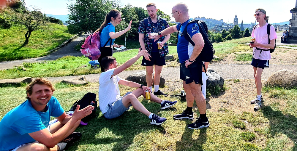 Calton Hill high fives Bright PUrple Edinburgh 7 Hills Challenge