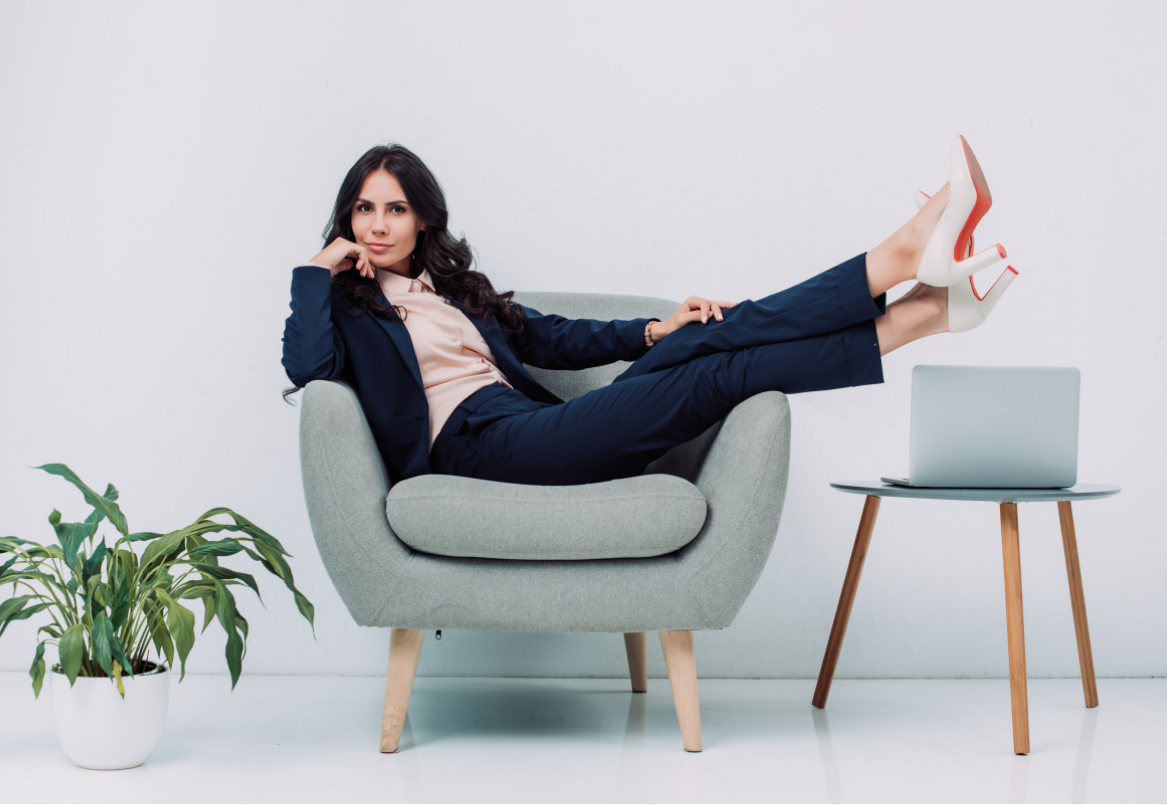 Women in armchair, working from home